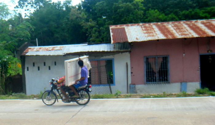 motorcycle carrying a table