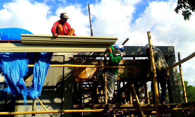 gutters being installed on our new roof in the Philippines